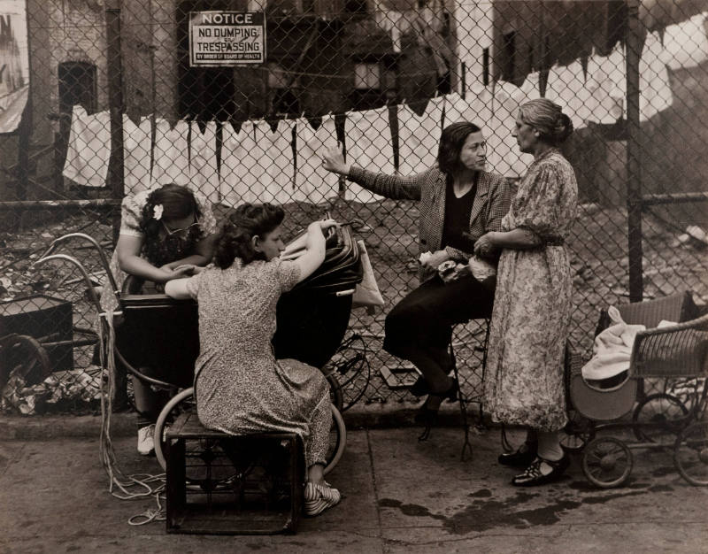 Group of Women in Front of Fence