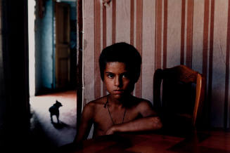 Gypsy Boy with Pet Pug in Marseilles, France