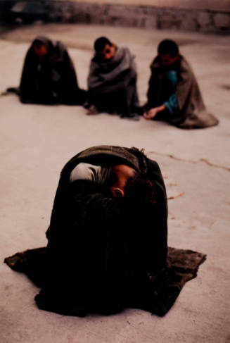 War Victim at Asylum Buries His Head in Blanket, Kabul